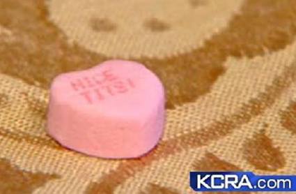 A candy heart reading "Nice tits!"