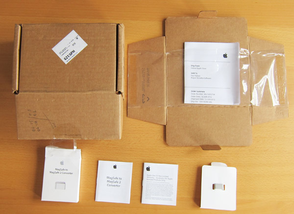 The Adapter, its box, the card it rode in on, and the box which contained it all.